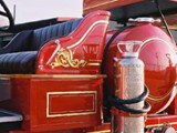 22k gold leaf scroll work and pinstripes on 1934 Ford fire engine. Featured in SignCraft magazine.